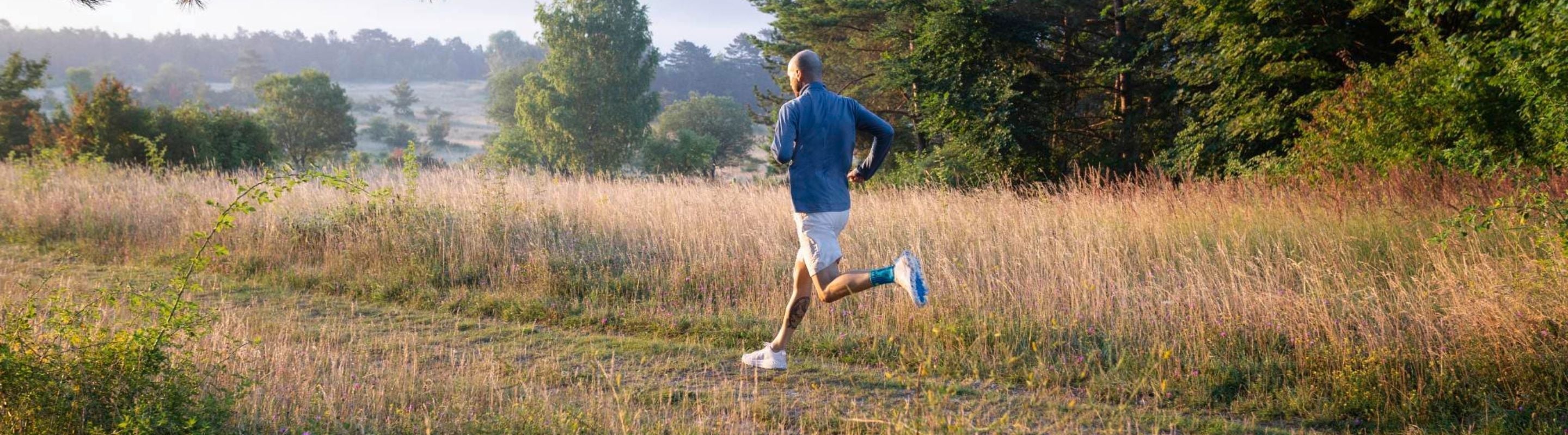 man running through a field