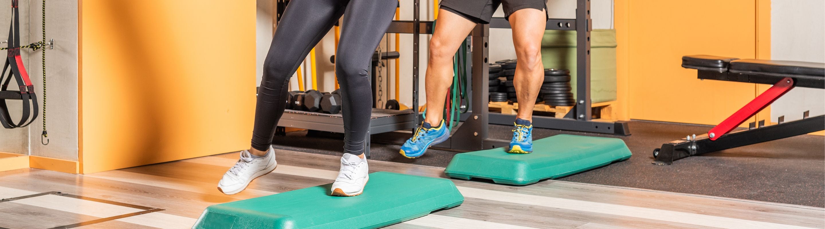 People doing jump ups at the gym for knee strength and balance