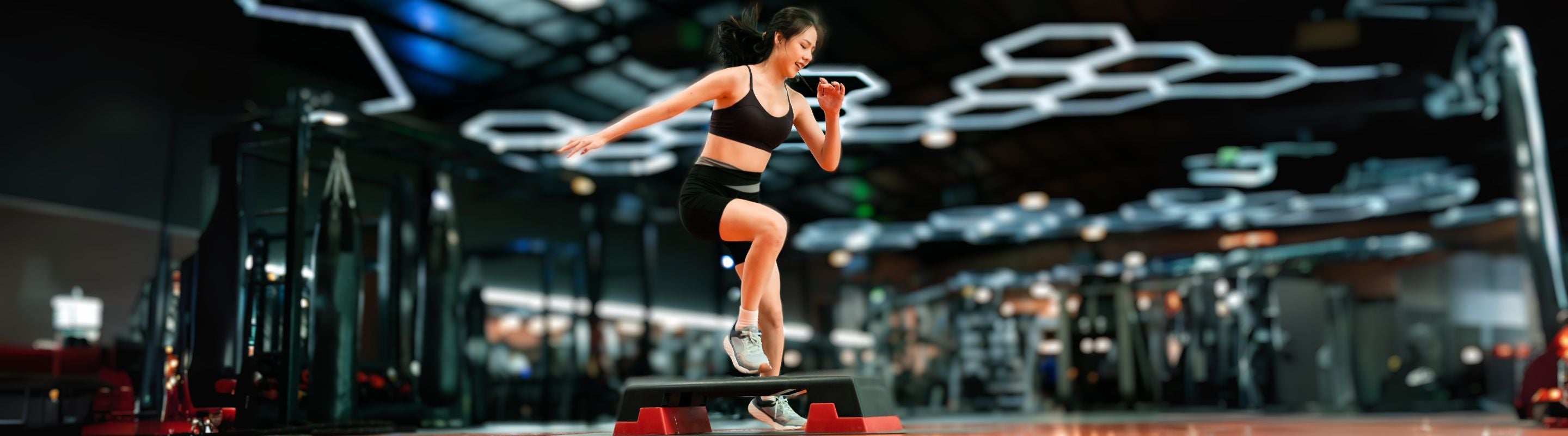 Woman doing up and overs at the gym