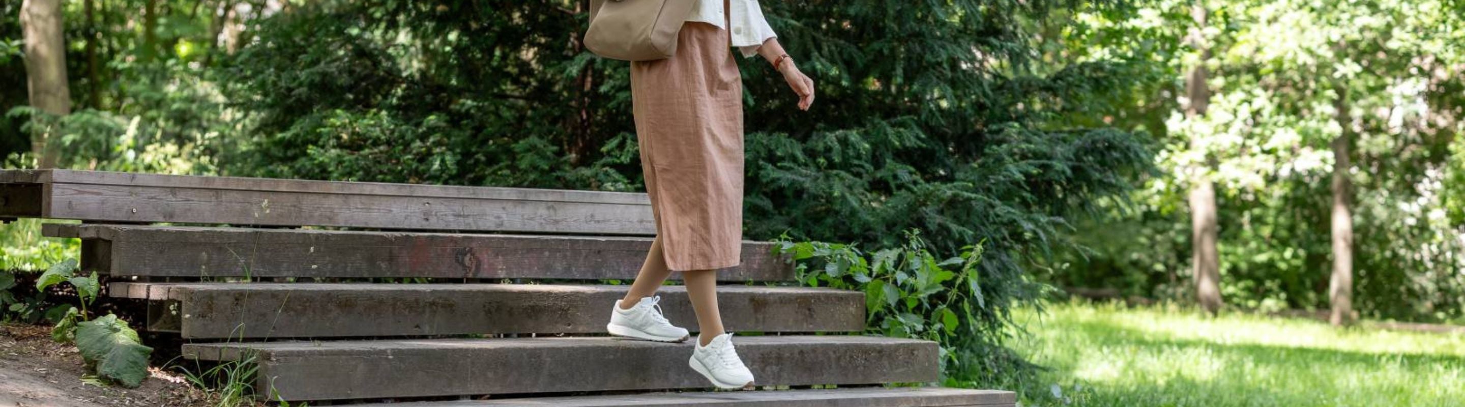 woman walking through the part in VenoTrain Compression Socks