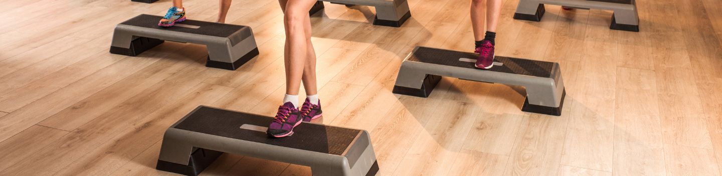 Two people doing the quick feet exercise at the gym