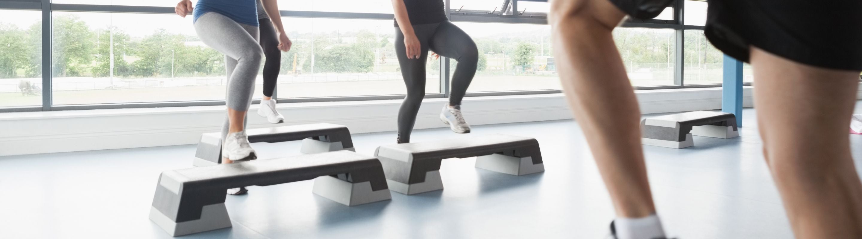 People doing toe taps at the gym