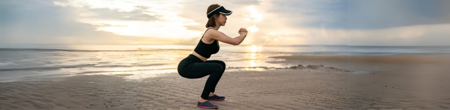 woman at the part performing the Serial Sitting Exercise in the GenuTrain P3 Knee Brace