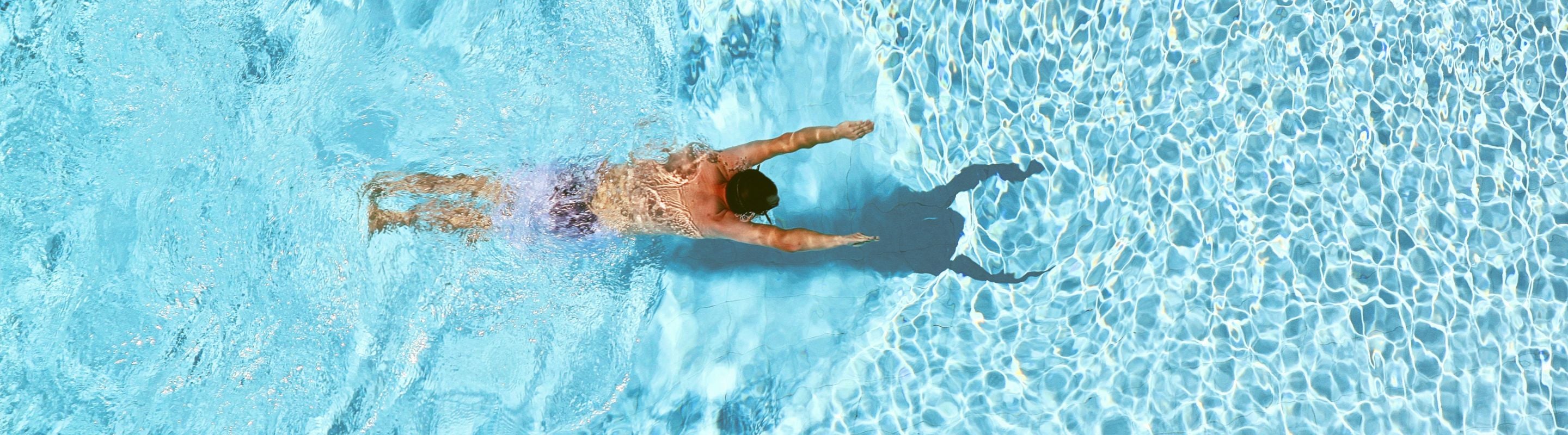 Person swimming in a pool