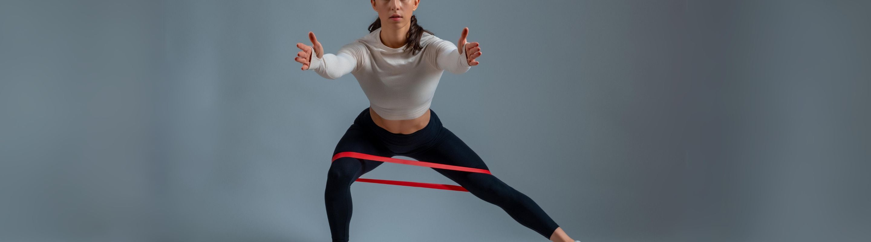 woman doing the clock lunges exercise with a resistance band