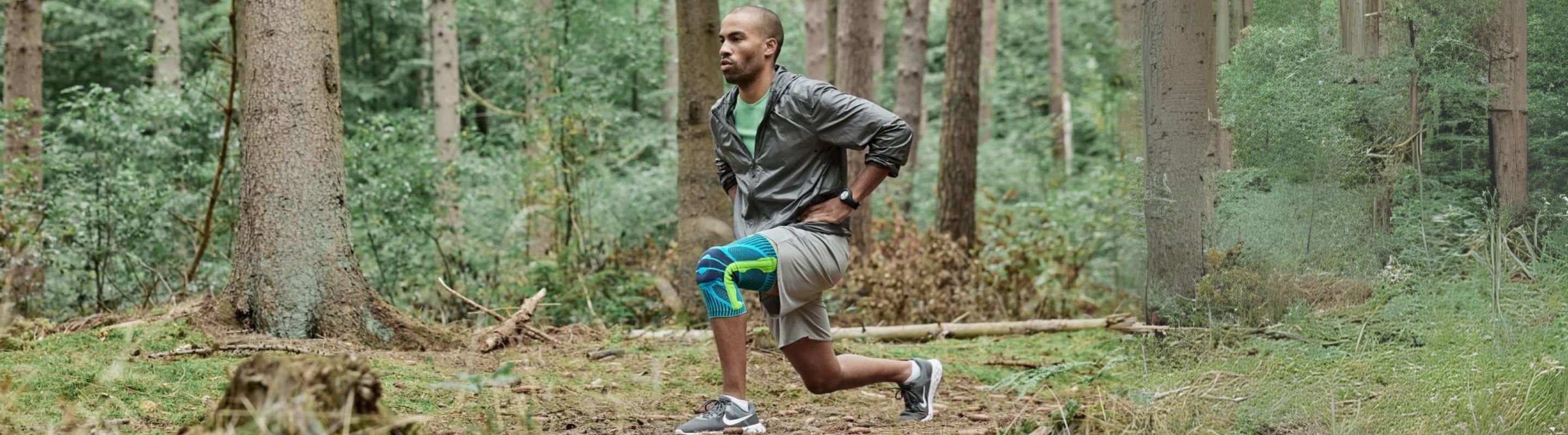 Man in the woods doing lunges in Bauerfeind's Sports Knee Support