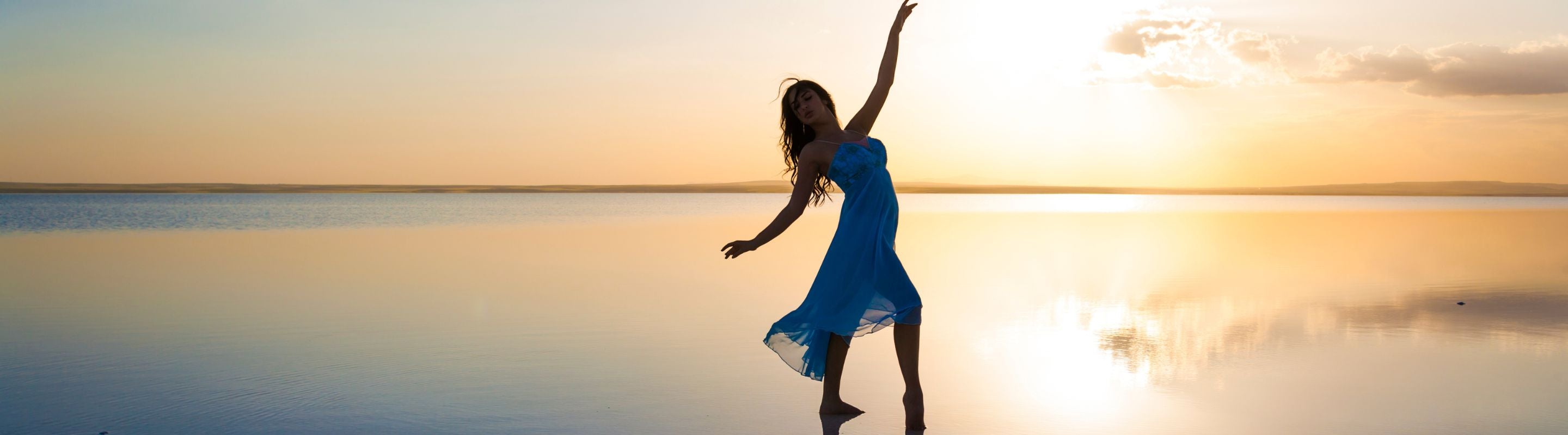 Woman dancing on the beach