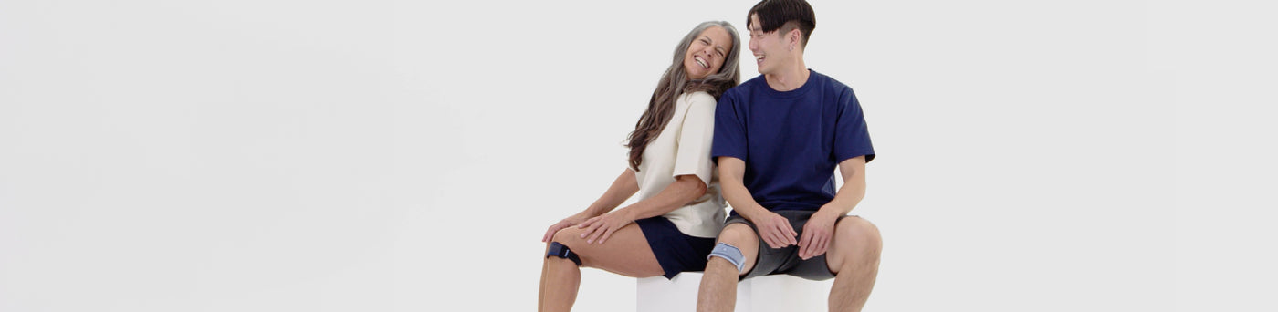 runners sitting in Bauerfeind's GenuPoint Knee Straps