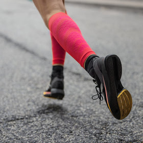 a girl wearing Bauerfeind compression calf sleeves