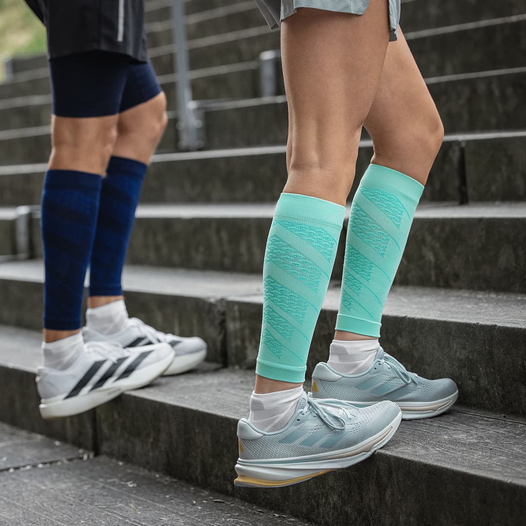two people wearing Bauerfeind Sports Compression Calf Sleeves Light